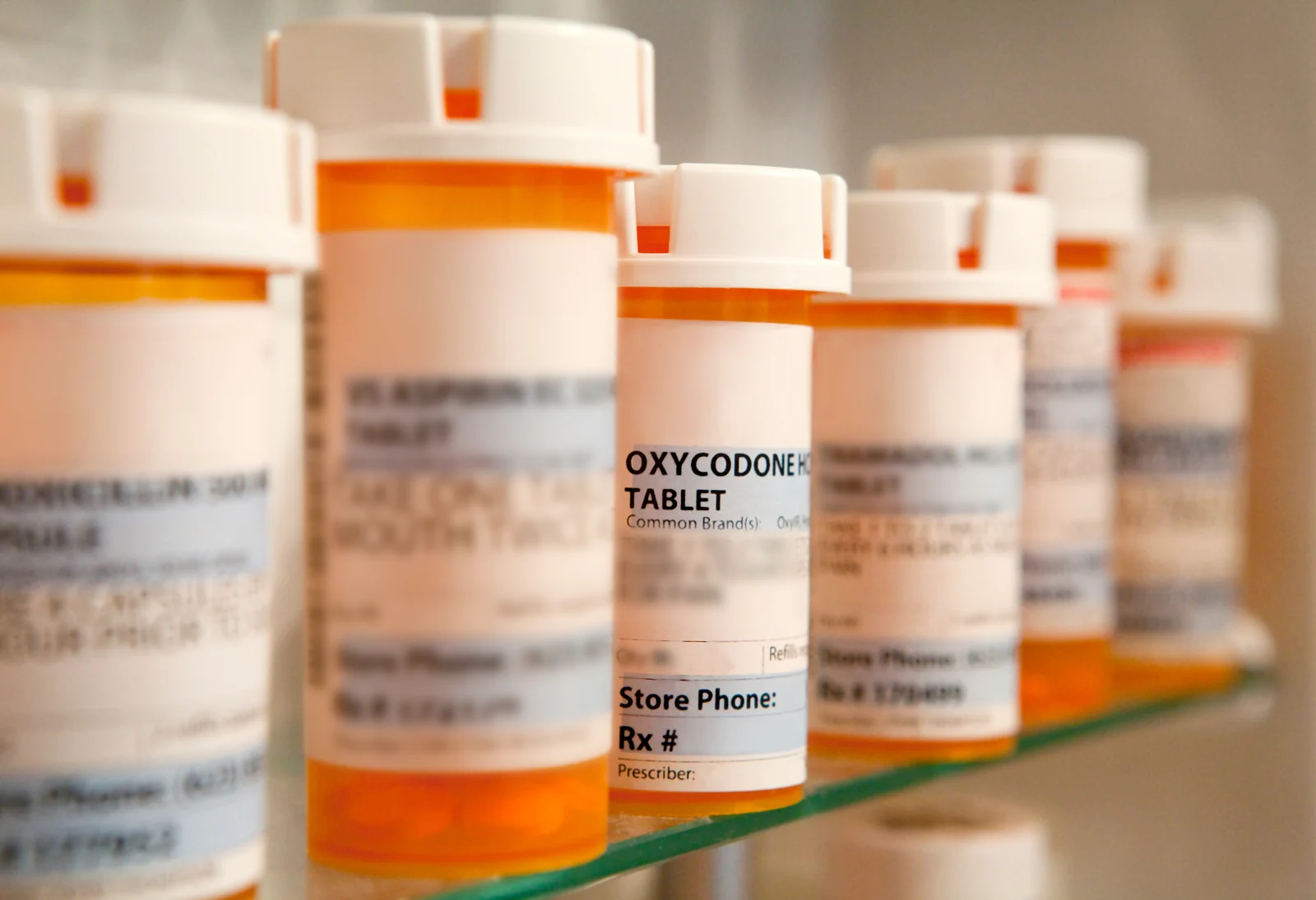 Prescription bottles in a medicine cabinet